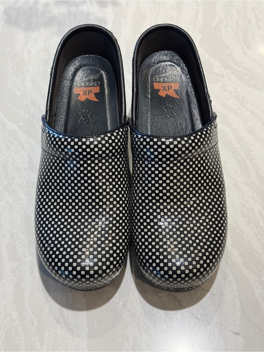 Dansko Women's Black & White Checkered Clogs